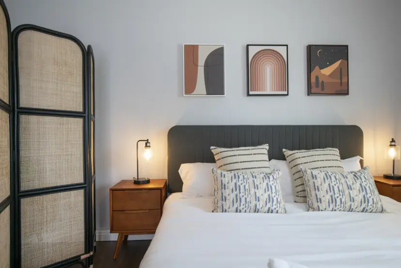 Bed beside a rattan screen