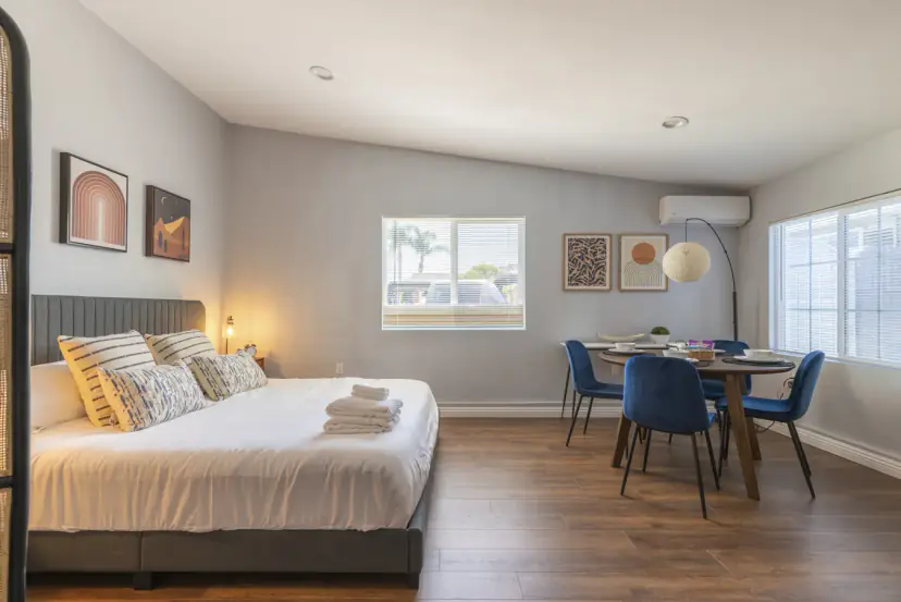 Studio with the king bed and the round dining table