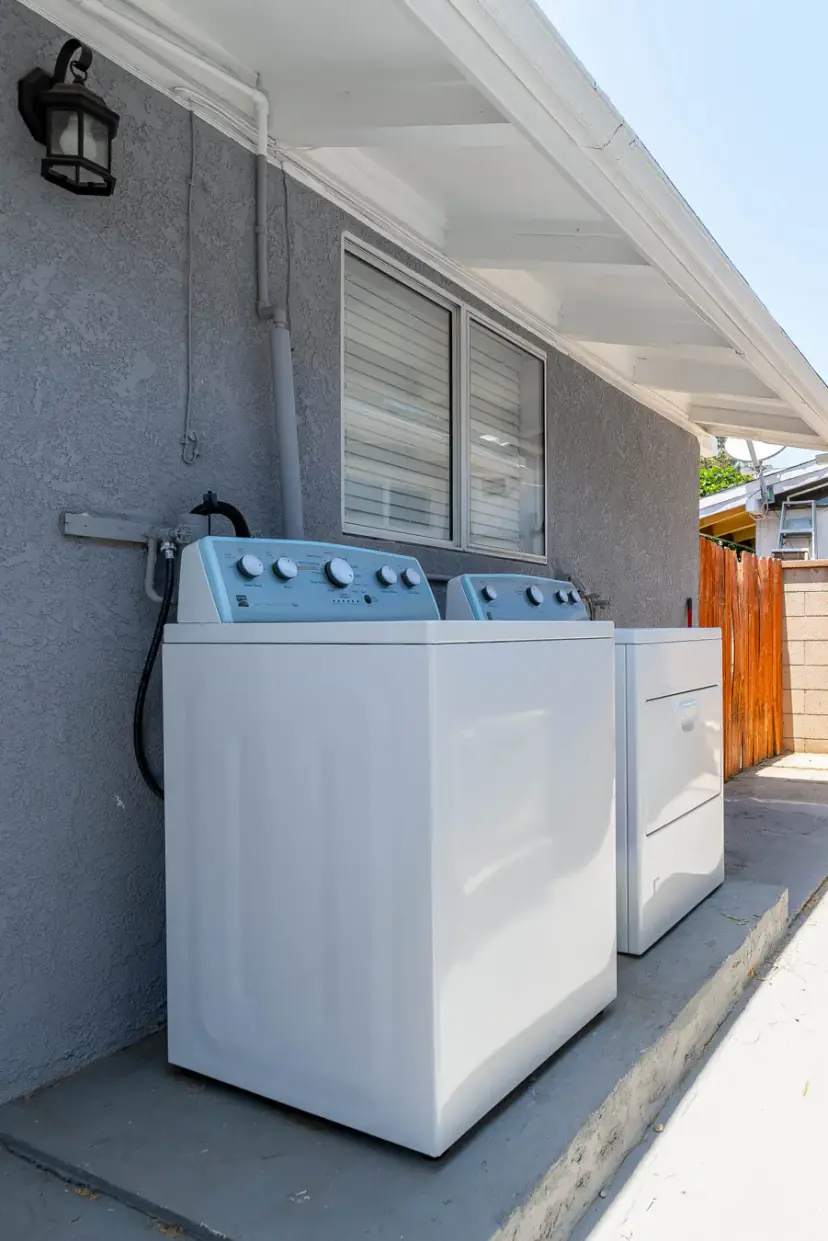 Outdoor washer and dryer under the eave