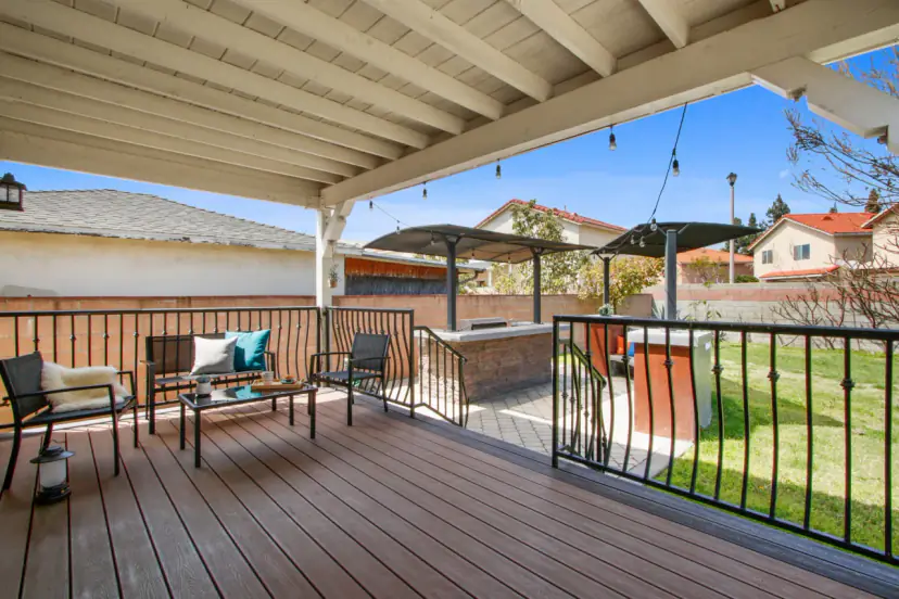 Deck with patio chairs and string lights
