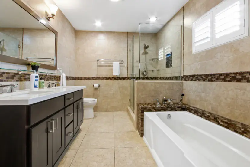 Bathroom with a soaking tub and a glass shower