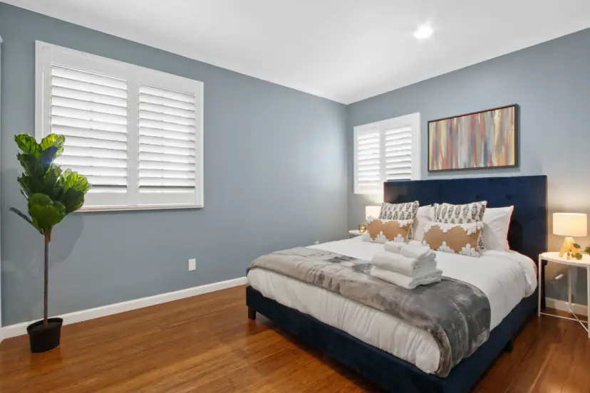 Bedroom with a navy upholstered bed