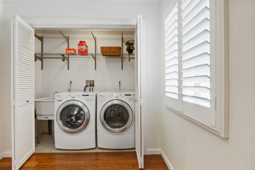 Laundry closet with a washer and dryer