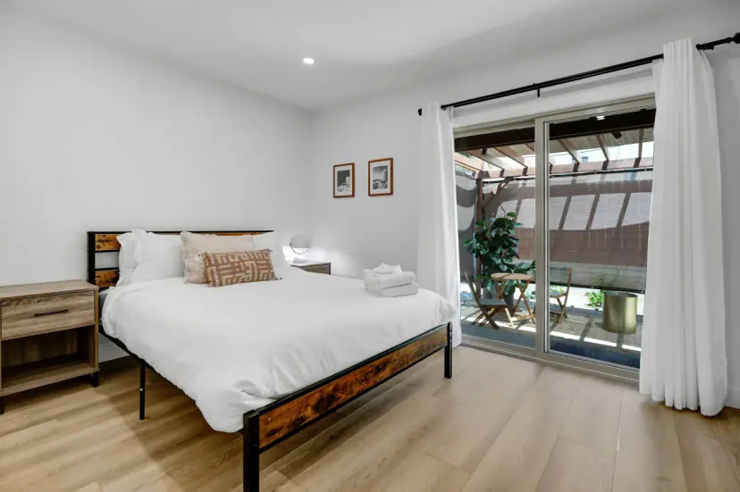 Bedroom with a sliding glass door onto the patio