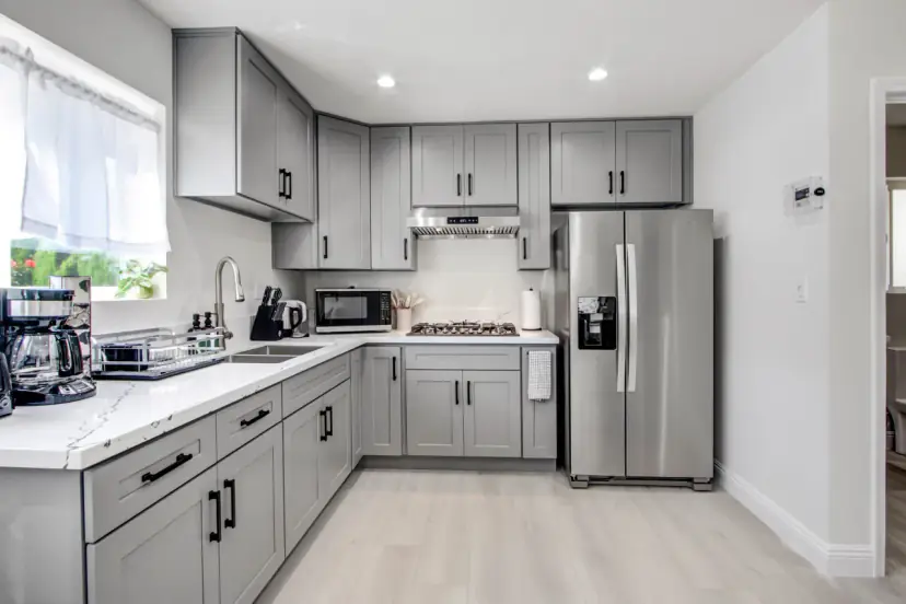 L-shaped kitchen with grey cabinets