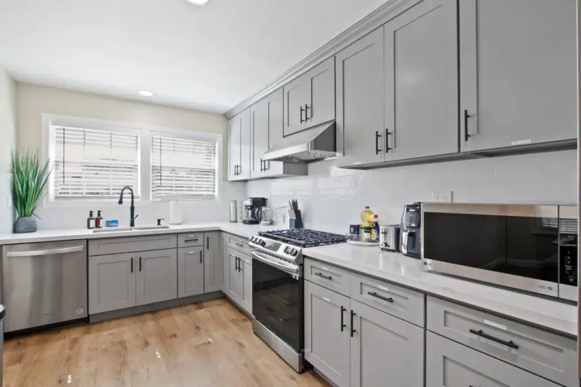 Kitchen with a dishwasher and a microwave