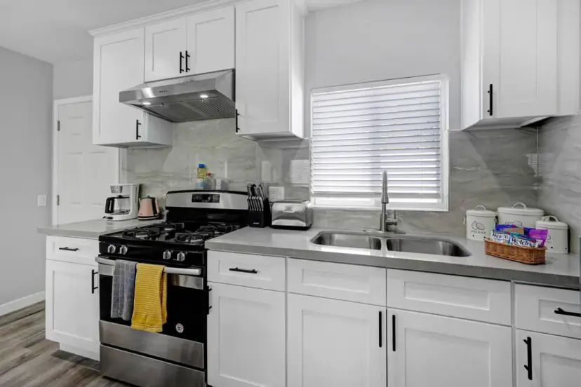 Kitchen with a double sink and a gas range