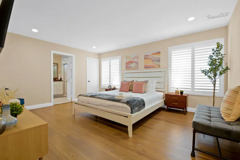 Bedroom with a bed and plantation shutters