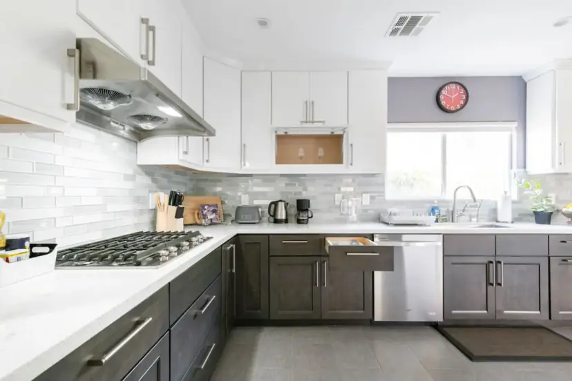 Kitchen with a gas cooktop and a glass backsplash