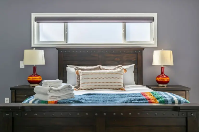 Bedroom with a dark wood headboard